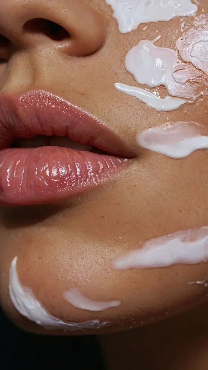 Close-up of skin during a treatment, product applied across the cheek